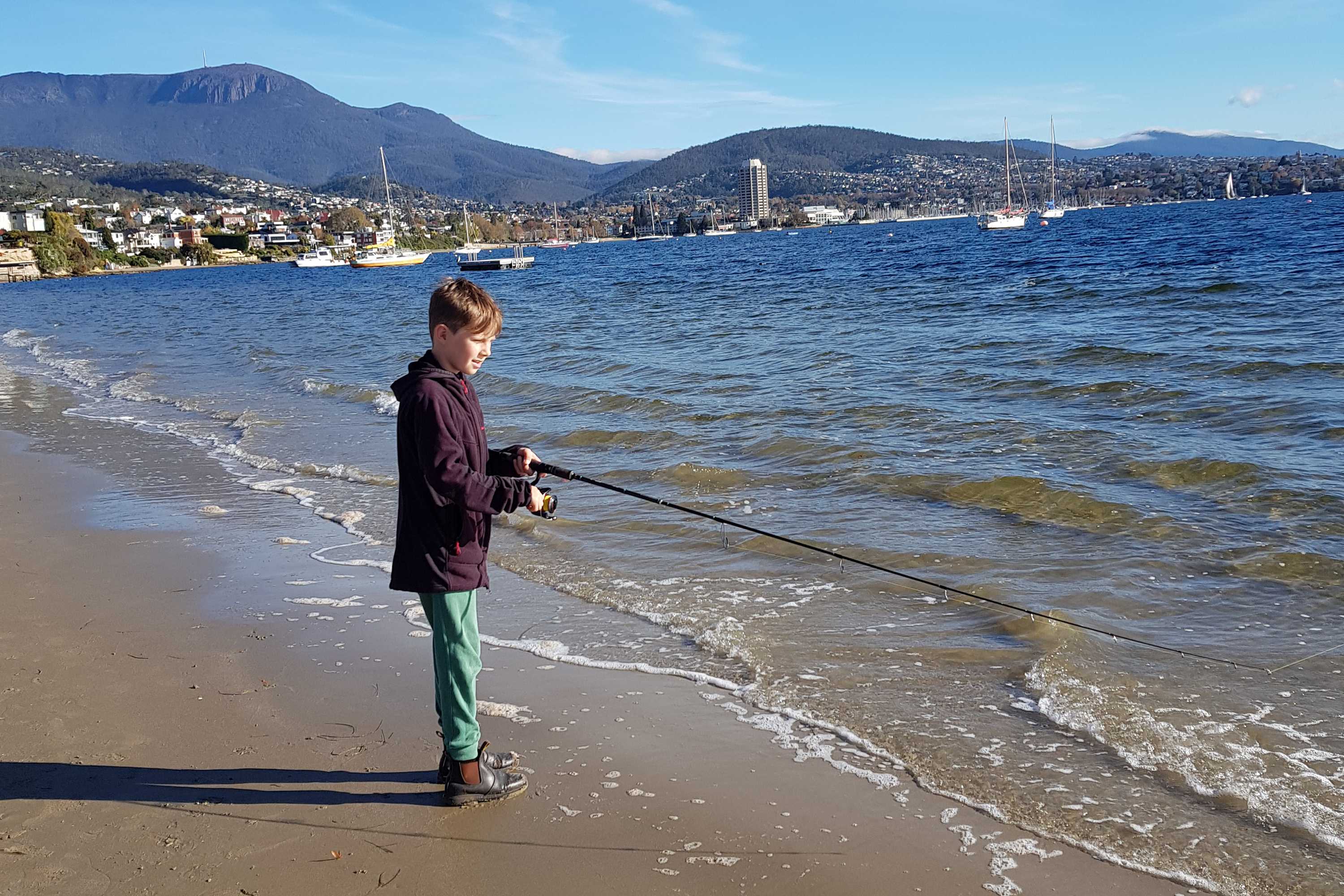 Fishing at Nutgrove Beach, Sandy Bay, Tasmania.